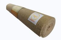 Earthy and natural brown jute yoga mat rolled up with durable carrying strap