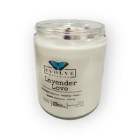 Soothing lavender-scented soy candle lit, illuminating the amethyst gemstone