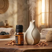 Premium Sandalwood Pure Organic Essential Oil styled next to active ultrasonic ceramic diffuser - Clerina